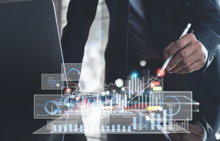 a hand drawing a trend graph in mid-air