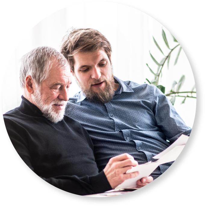 a man with his dad looking at papers