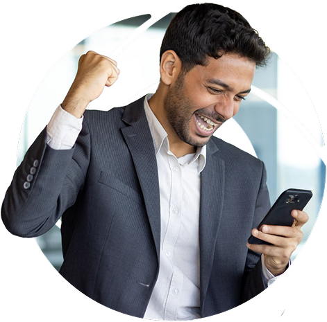 a man looking at his phone doing a fistbump